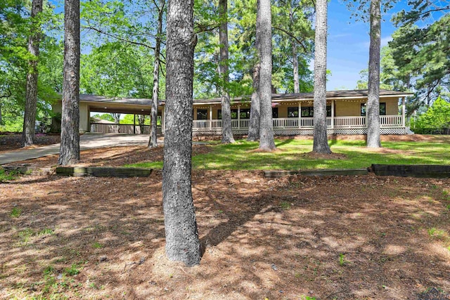 exterior space with a porch and a carport