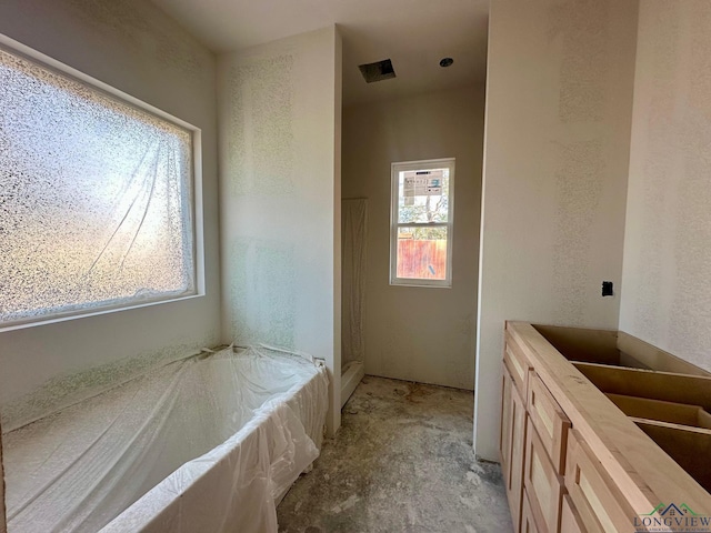 bathroom with a tub