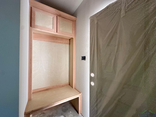 mudroom with concrete floors