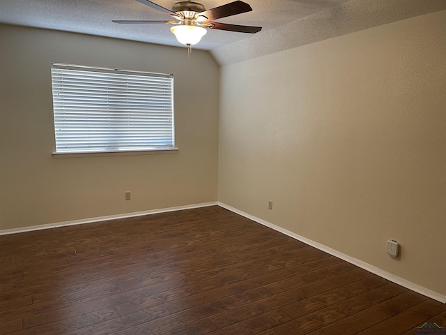 411 E Carolanne Blvd, Marshall, TX 75672 - spare room featuring ceiling fan, dark wood finished floors, baseboards, a textured ceiling, and vaulted ceiling