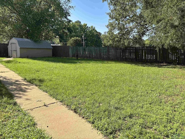411 E Carolanne Blvd, Marshall, TX 75672 - view of yard featuring a storage unit and an outbuilding