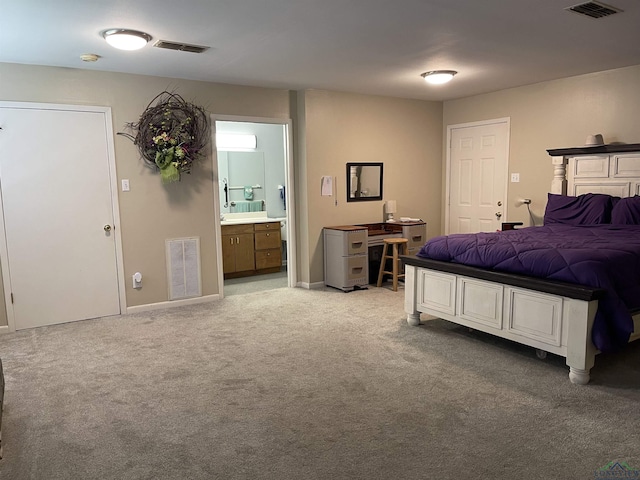 411 E Carolanne Blvd, Marshall, TX 75672 - bedroom with light carpet, connected bathroom, and baseboards