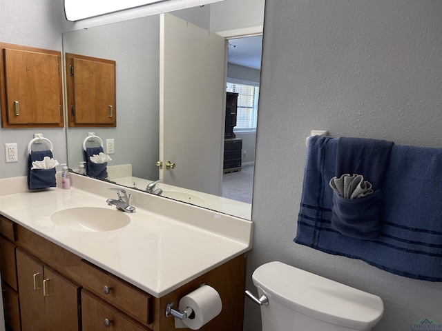 411 E Carolanne Blvd, Marshall, TX 75672 - half bath with a textured wall, toilet, and vanity