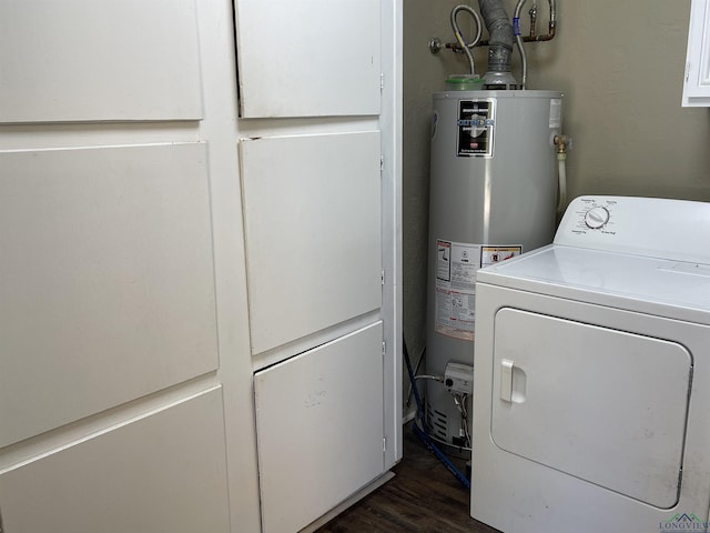 411 E Carolanne Blvd, Marshall, TX 75672 - laundry room with washer / dryer, gas water heater, and dark wood-type flooring