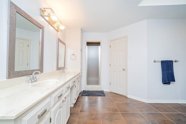 bathroom with tile patterned floors and vanity