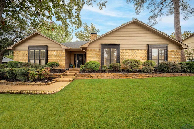 ranch-style home with a front lawn