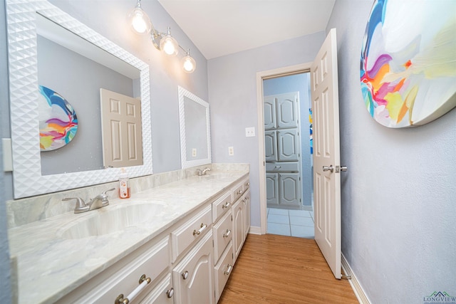 bathroom featuring vanity and hardwood / wood-style flooring