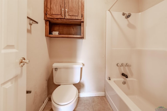 bathroom featuring toilet, tile patterned flooring, and washtub / shower combination