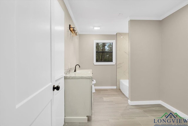 bathroom with toilet, crown molding, and vanity