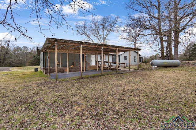 exterior space with a lawn and an outbuilding