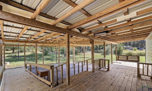 wooden terrace featuring a yard