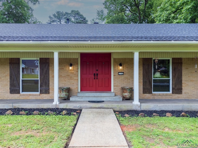 property entrance featuring covered porch