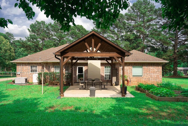 3713 Bell Mdws, Longview, TX 75605 - rear view of house featuring a gazebo, a patio, a yard, and brick siding