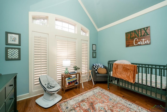 1124 Stillmeadow Ln, Longview, TX 75604 - bedroom with a crib, wood finished floors, and high vaulted ceiling