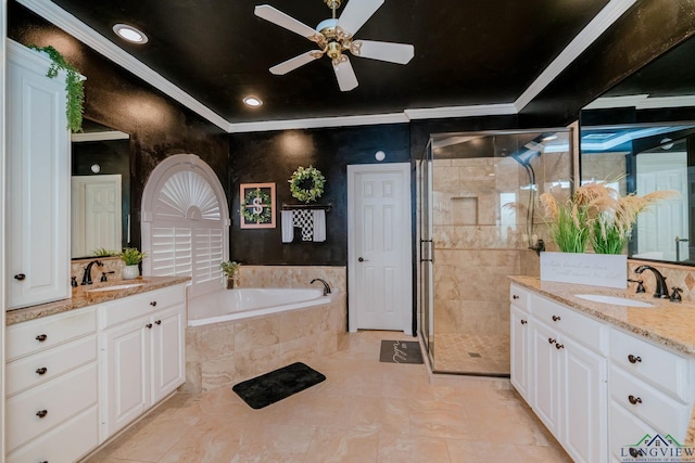 1124 Stillmeadow Ln, Longview, TX 75604 - full bath featuring two vanities, ceiling fan, a bath, a stall shower, and ornamental molding