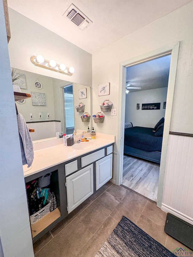 902 Warren Dr, Marshall, TX 75672 - bathroom featuring vanity, ensuite bathroom, and tile patterned flooring