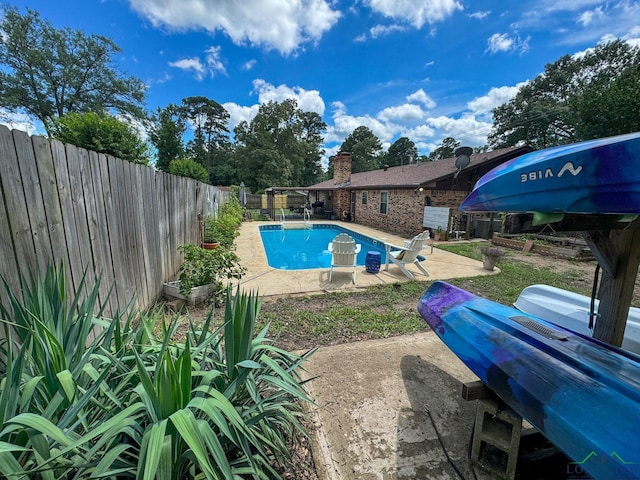 902 Warren Dr, Marshall, TX 75672 - view of swimming pool featuring a fenced backyard, a patio, and area for grilling