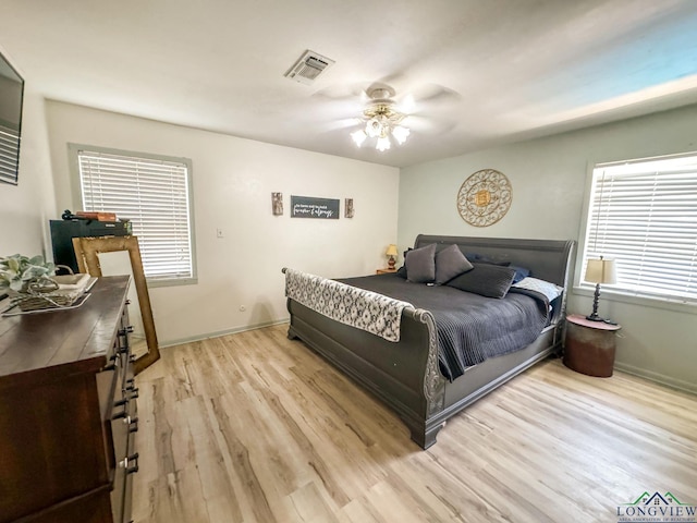 902 Warren Dr, Marshall, TX 75672 - bedroom with light wood-style flooring and ceiling fan