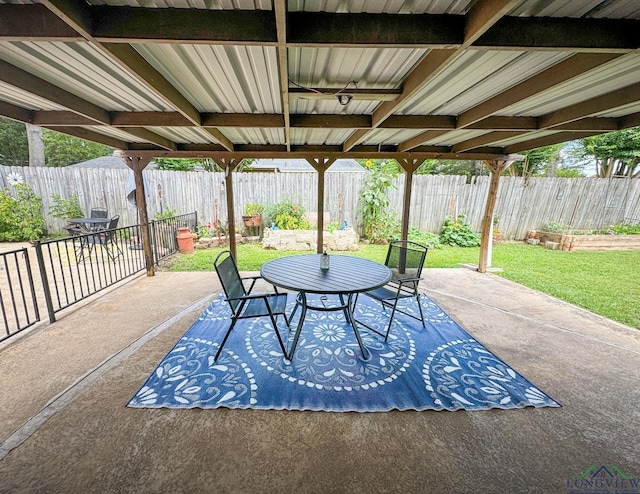 902 Warren Dr, Marshall, TX 75672 - fenced backyard with a patio area and outdoor dining space