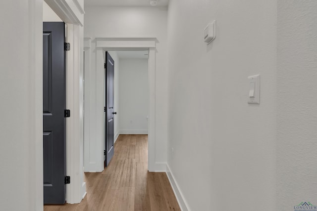 1507 Wellington Ln, Longview, TX 75605 - hallway featuring light wood-style floors and baseboards