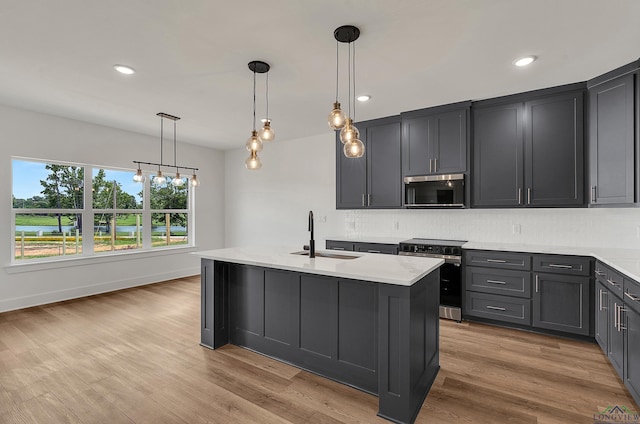 1507 Wellington Ln, Longview, TX 75605 - kitchen with stainless steel appliances, a sink, decorative backsplash, light countertops, and recessed lighting