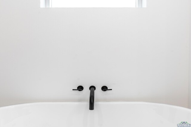 1507 Wellington Ln, Longview, TX 75605 - bathroom view of a soaking tub and a sink