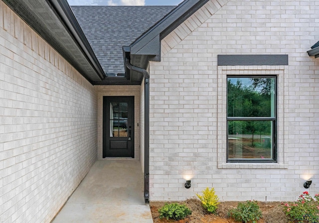 1507 Wellington Ln, Longview, TX 75605 - entrance to property with brick siding and a shingled roof