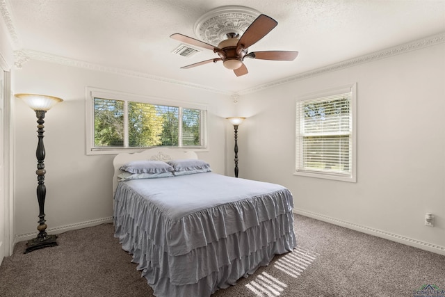 bedroom featuring carpet, ceiling fan, and crown molding