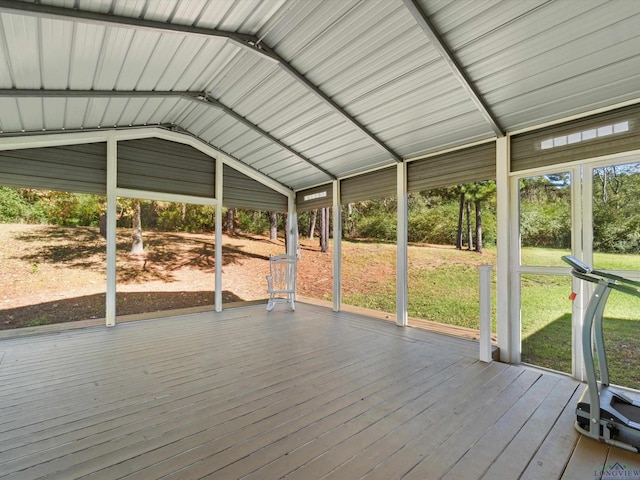 unfurnished sunroom with lofted ceiling