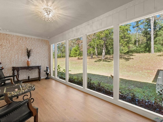 sunroom with a notable chandelier