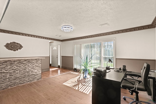 office with a textured ceiling and hardwood / wood-style flooring