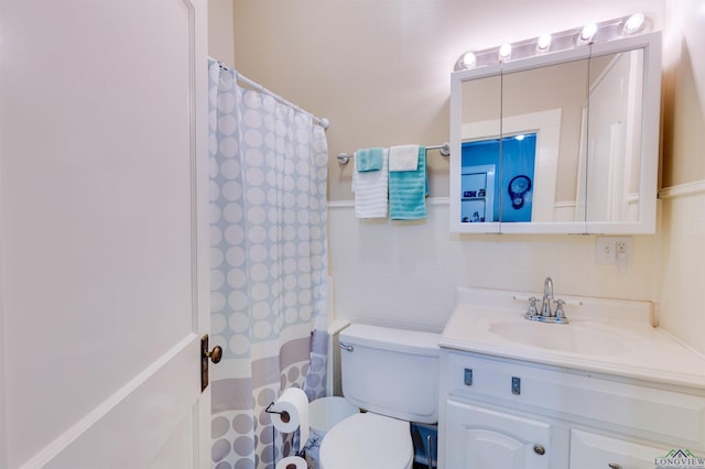 bathroom featuring a shower with curtain, vanity, toilet, and tile walls