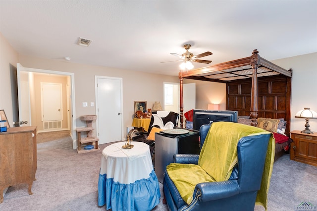 bedroom featuring ceiling fan and light carpet