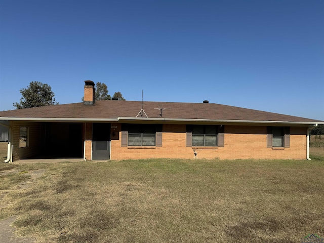 back of house featuring a yard