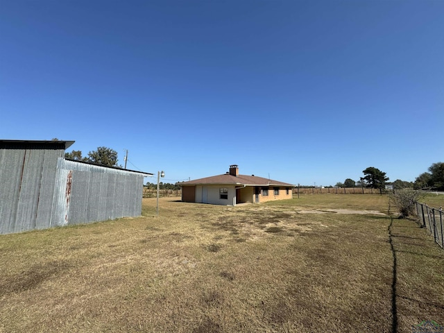 view of yard with a rural view