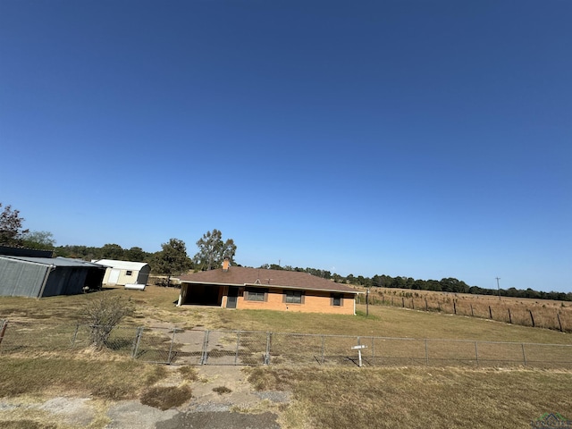 view of yard with a rural view