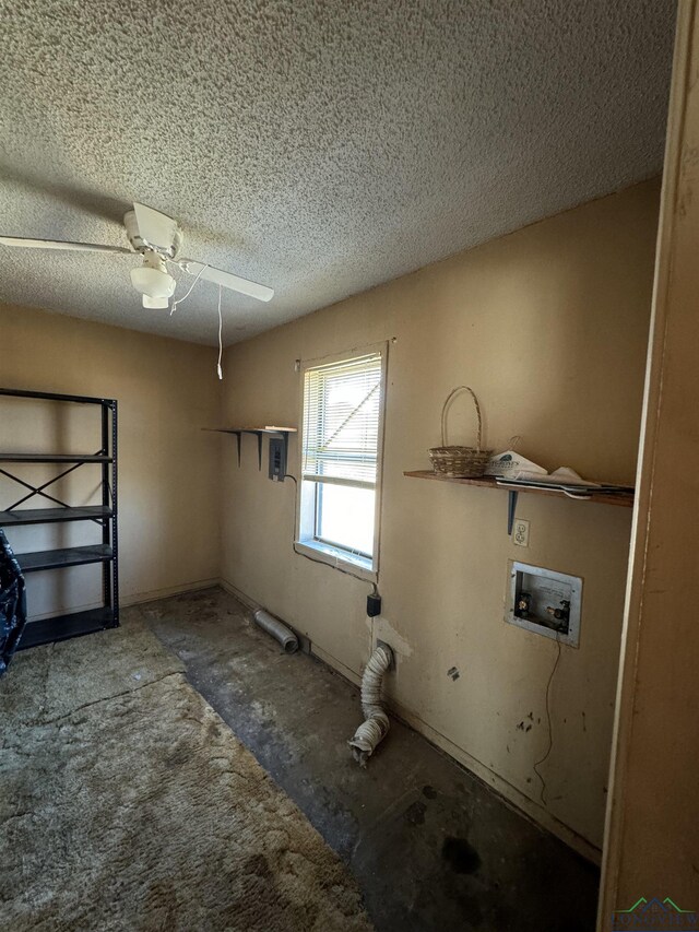 washroom featuring ceiling fan, washer hookup, and a textured ceiling