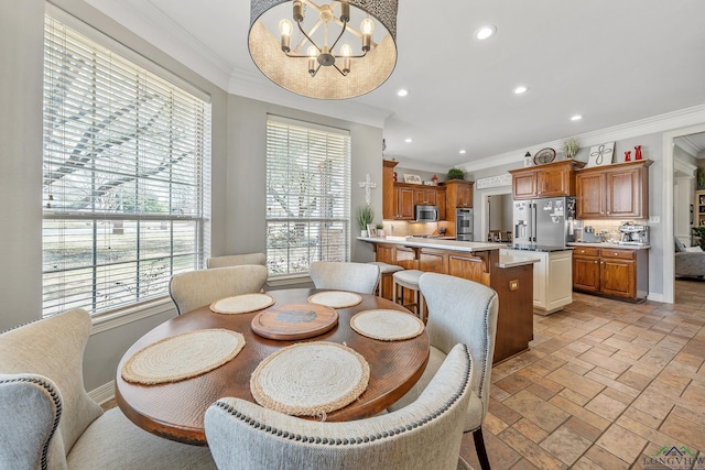 dining space with recessed lighting, a notable chandelier, baseboards, stone tile flooring, and crown molding