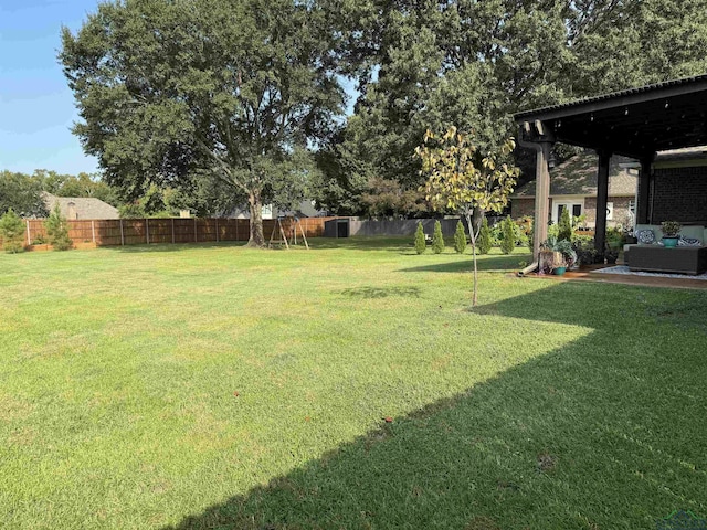 view of yard with a fenced backyard