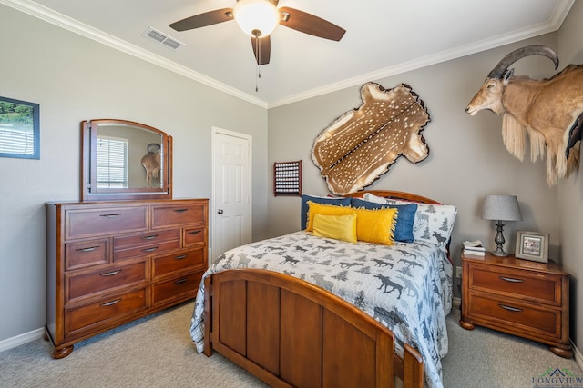 bedroom with visible vents, baseboards, light colored carpet, ceiling fan, and ornamental molding