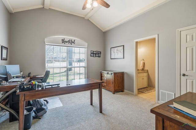 office space featuring visible vents, vaulted ceiling with beams, light carpet, and ceiling fan