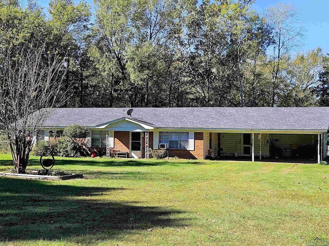 ranch-style home featuring a front yard and a carport