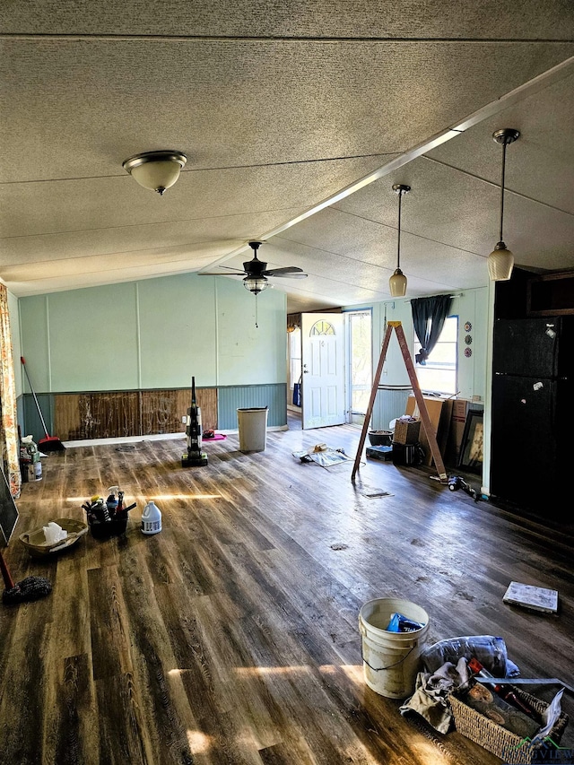 miscellaneous room featuring wood-type flooring, a textured ceiling, vaulted ceiling, and ceiling fan