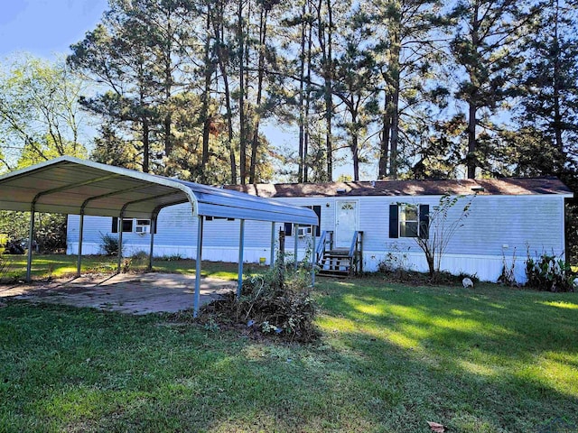 exterior space with a lawn and a carport