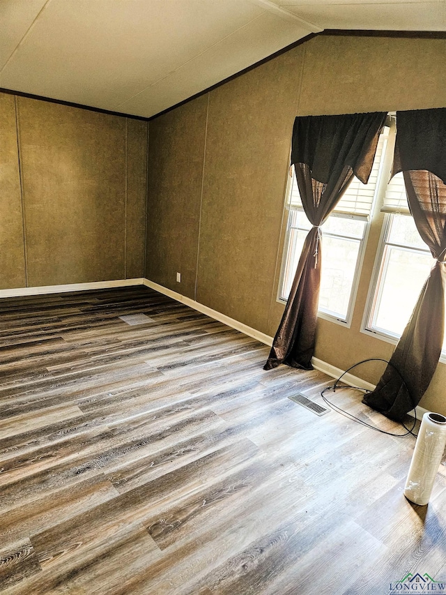 empty room with wood-type flooring