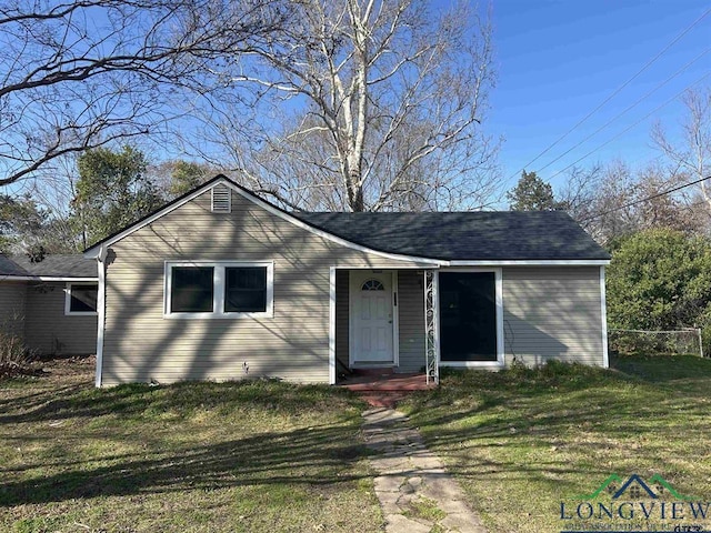 single story home featuring a front yard