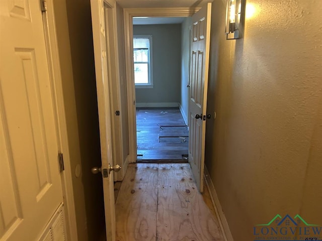 hall with light wood-type flooring