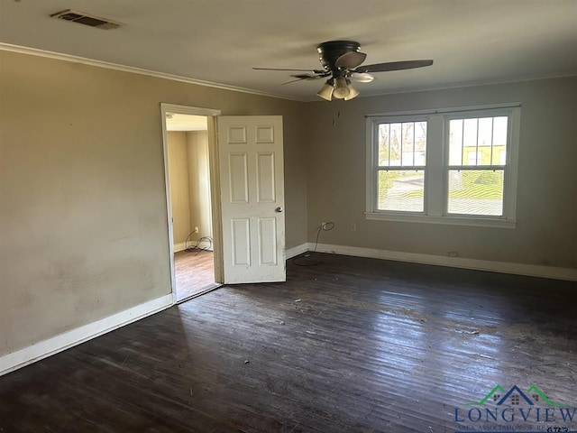 unfurnished bedroom with crown molding, dark hardwood / wood-style floors, and ceiling fan