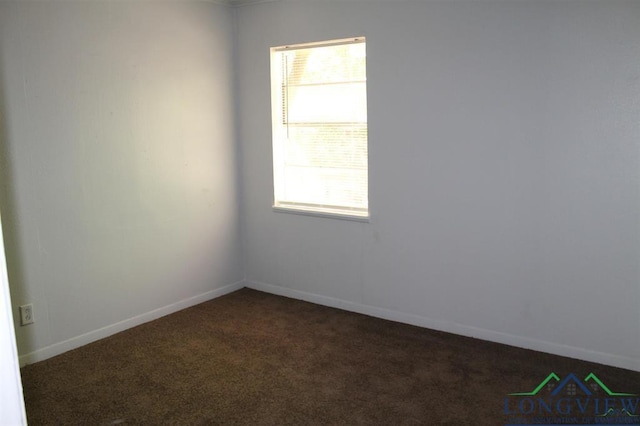 carpeted spare room with plenty of natural light