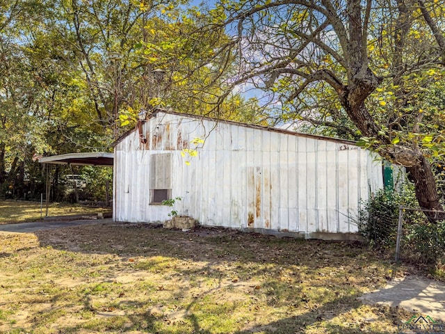 view of outdoor structure with a carport